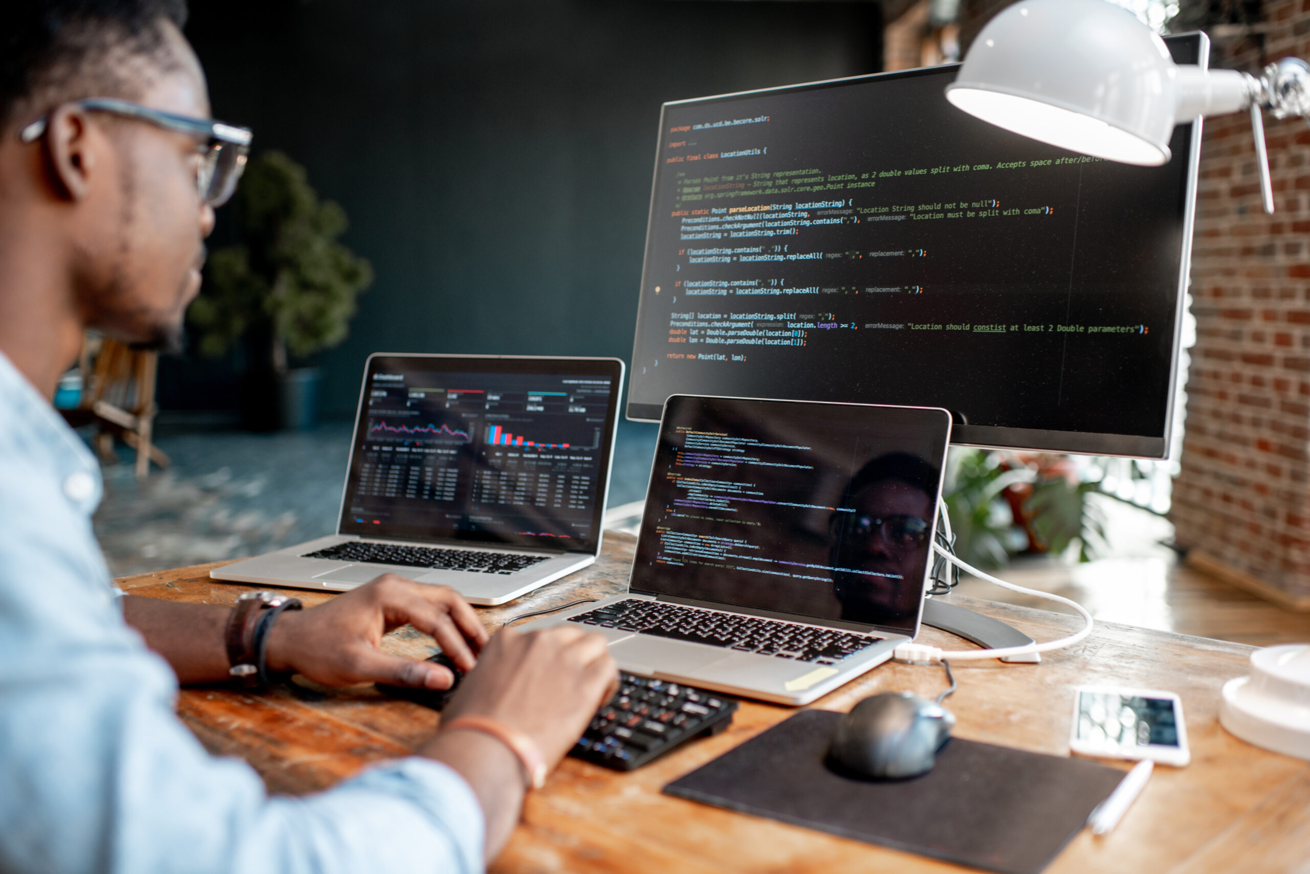 Young,African,Male,Programmer,Writing,Program,Code,Sitting,At,The Young,African,Male,Programmer,Writing,Program,Code,Sitting,At,The